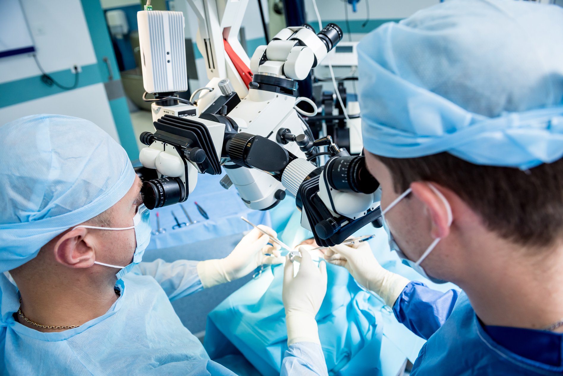 A team of surgeons performing brain surgery to remove a tumor.